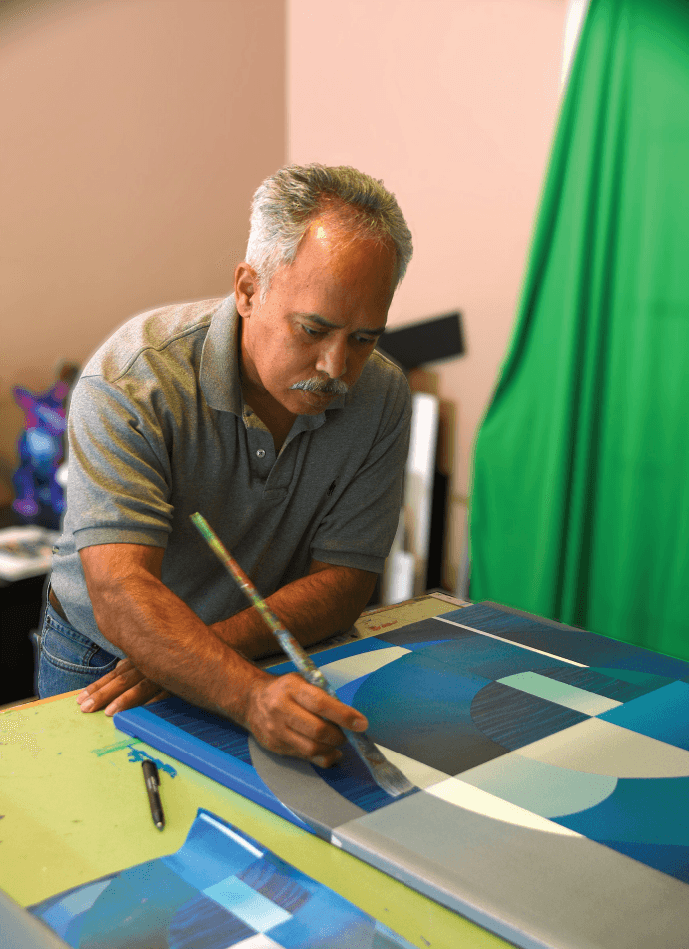 Hector Vega Working on Acrylic Artwork on Canvas